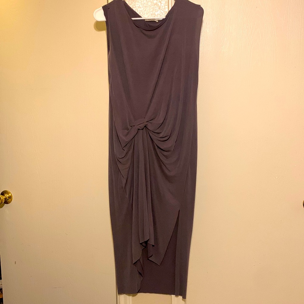 Sleeveless mauve dress.